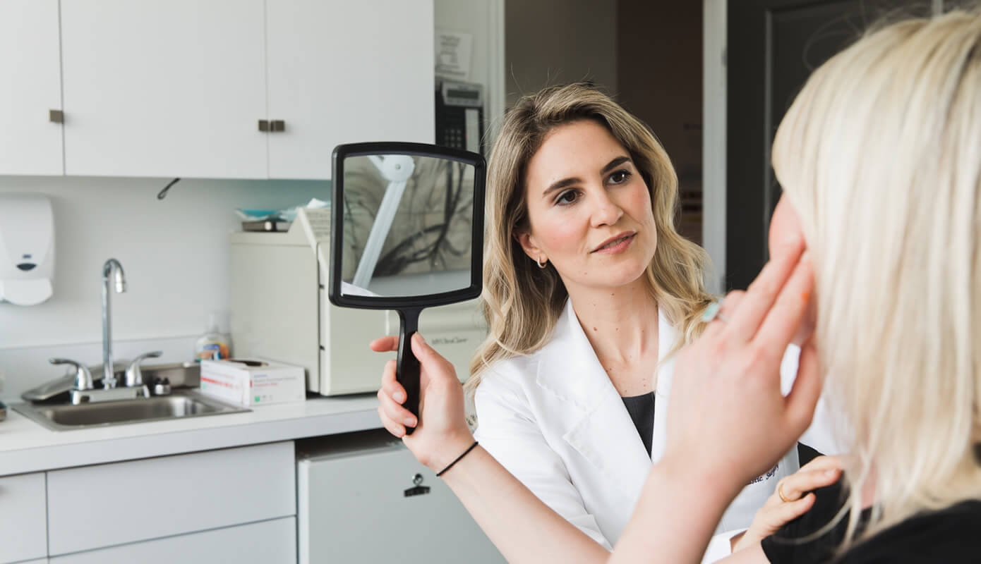 Dr. Maia with a patient in the medical office