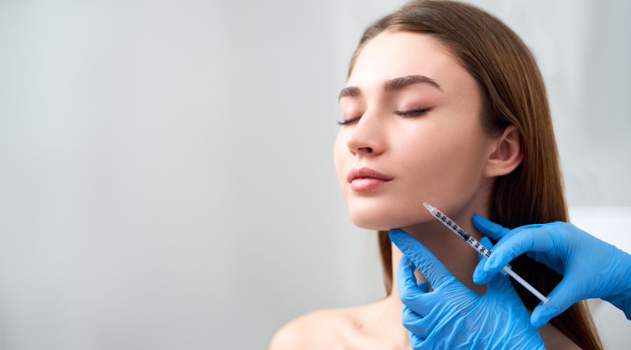 Woman undergoing marionette lines filler injections. 