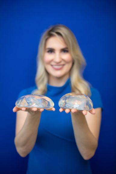 Dr. Maia showing breast implants